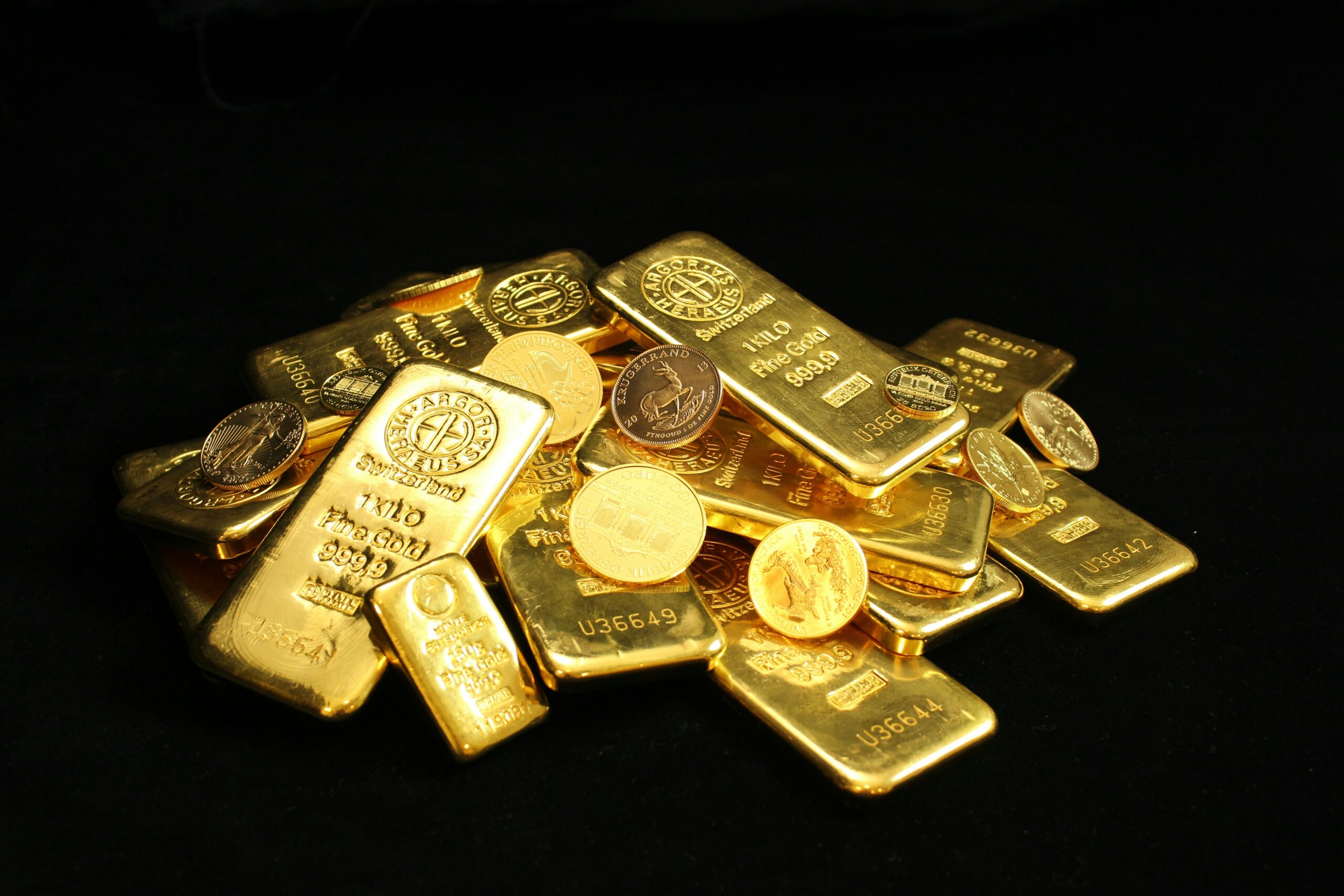 Why is gold falling: stacked gold bars